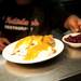 Holiday's chef Joe DeLaCruz plates a Thanksgiving dish Senior Turkey on Monday. Daniel Brenner I AnnArbor.com